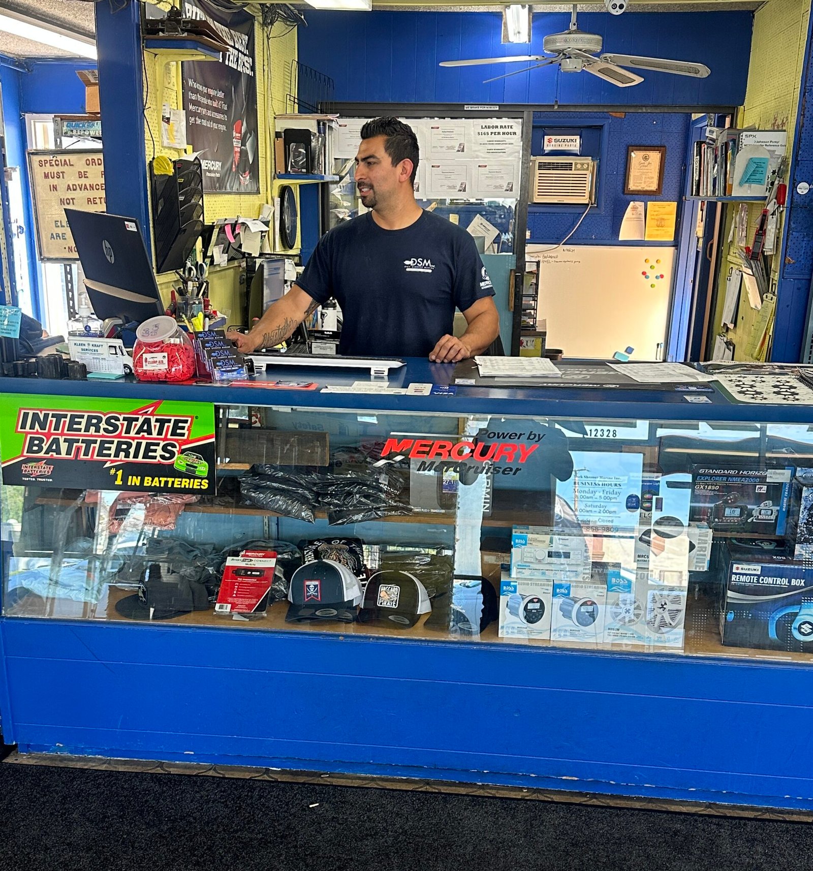 Boating technician working inside a boat shop in Norwalk